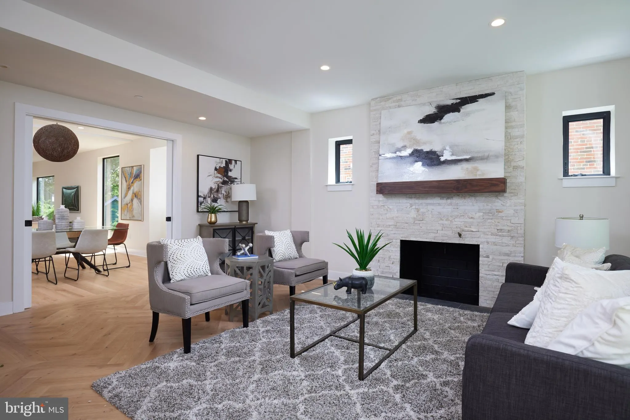 Living room with fireplace and access to dining area