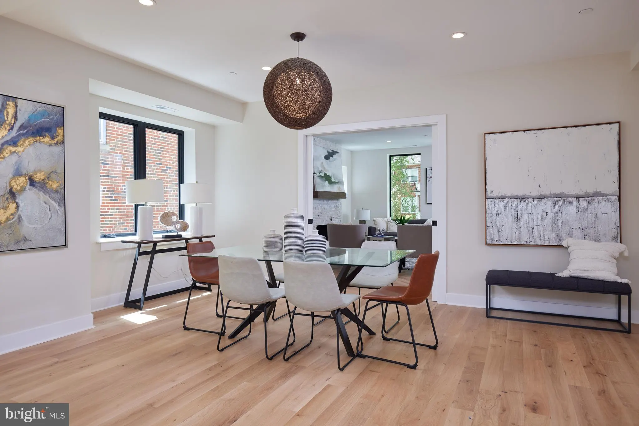 Dining and office area with round glass table and work desk