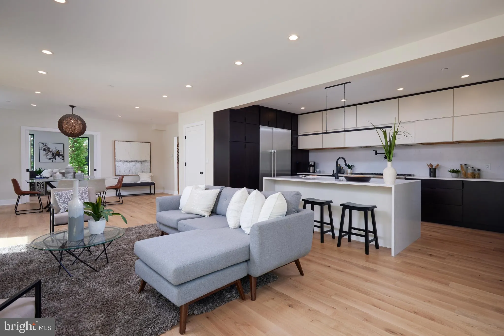 Open floor plan with kitchen, dining, and living areas combined