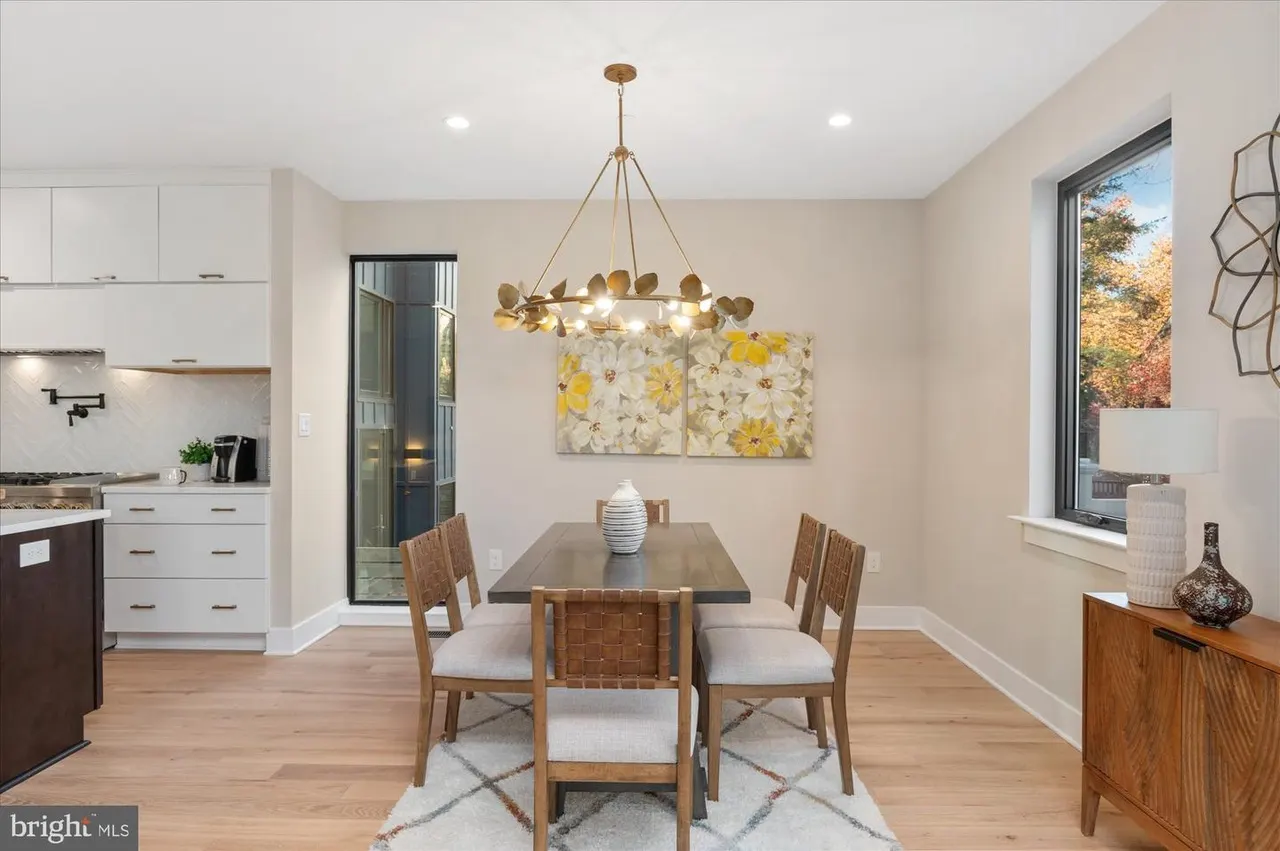 Dining area with brass chandelier and wood dining table