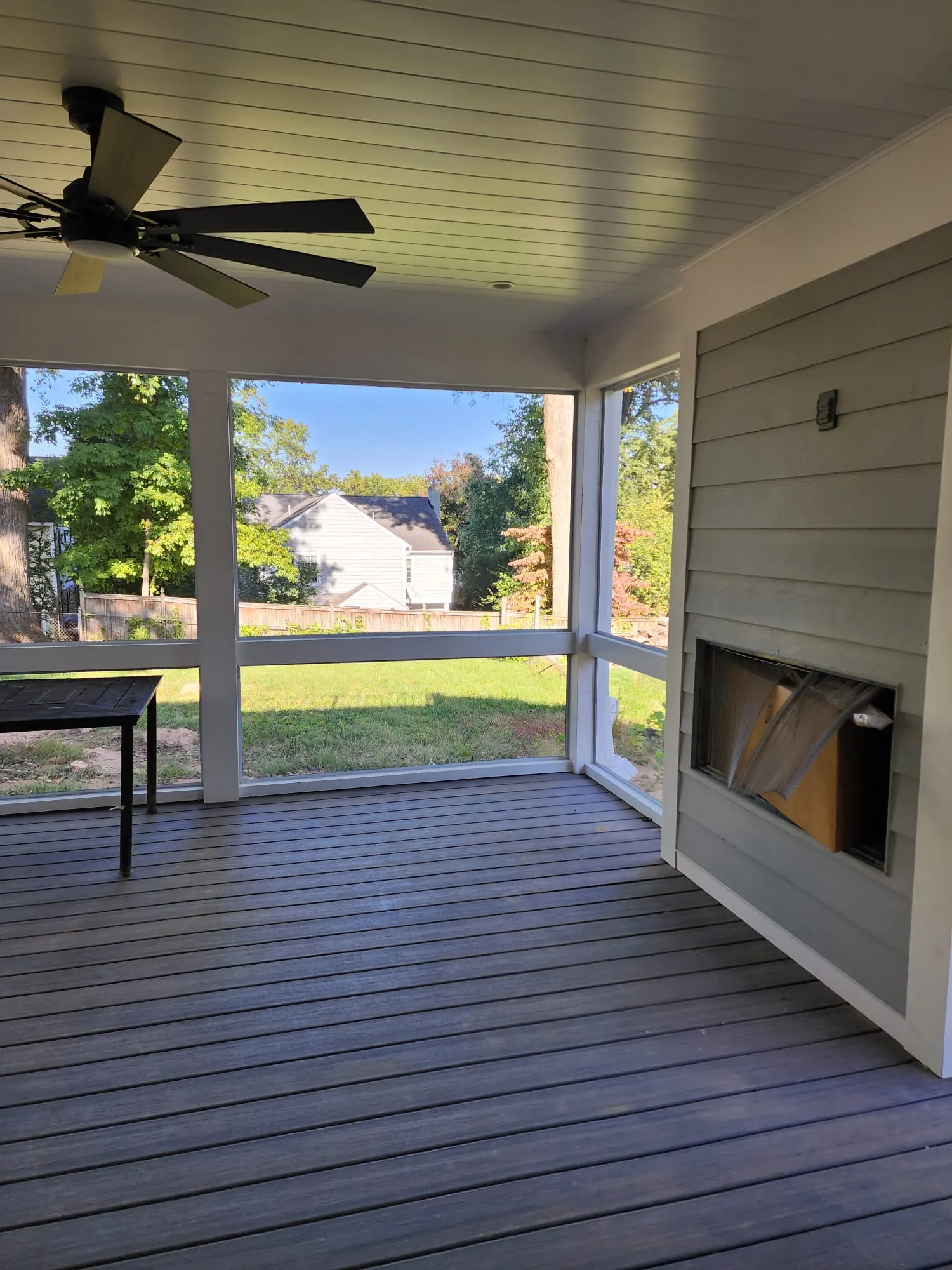 Screened porch with fireplace at 10120 Ashwood Dr in Kensington, a Colonial build