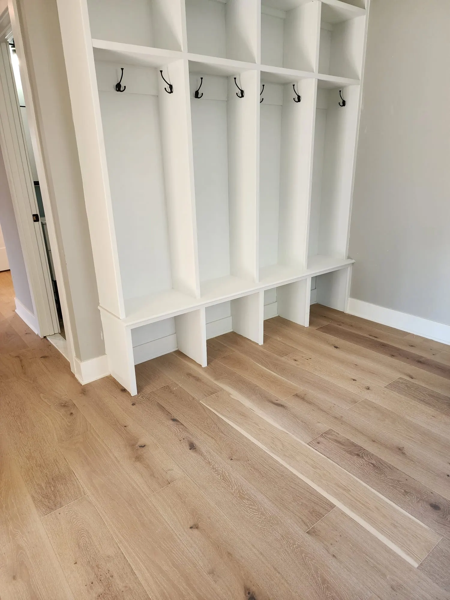 Mudroom built-ins with bench, cubbies, and coat hooks