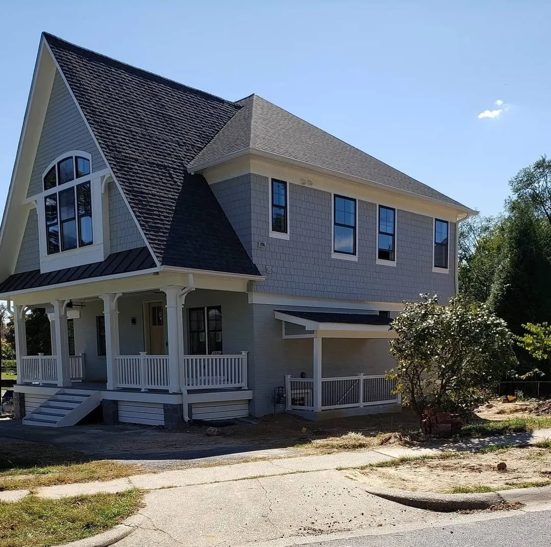 Shake-sided second story over a painted-brick first floor at Cushing Dr, Kensington