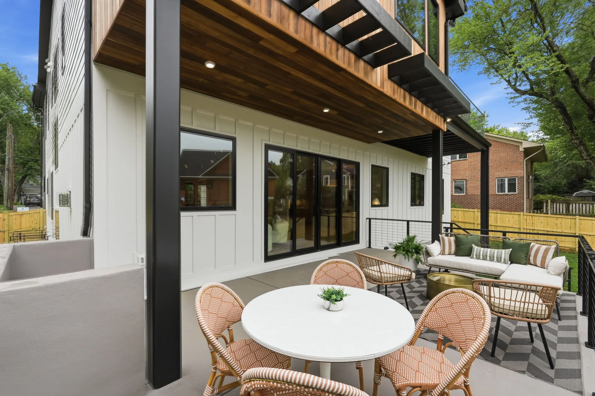 Patio with pergola, dining table and lounge seating area