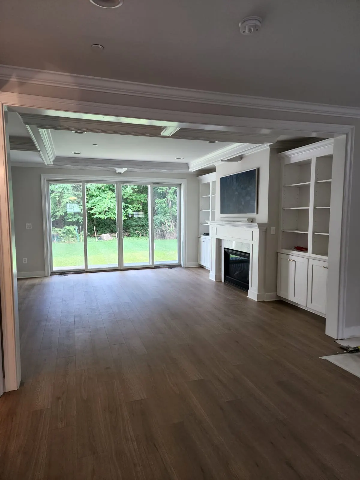 Living room with sliding glass doors opening to the backyard