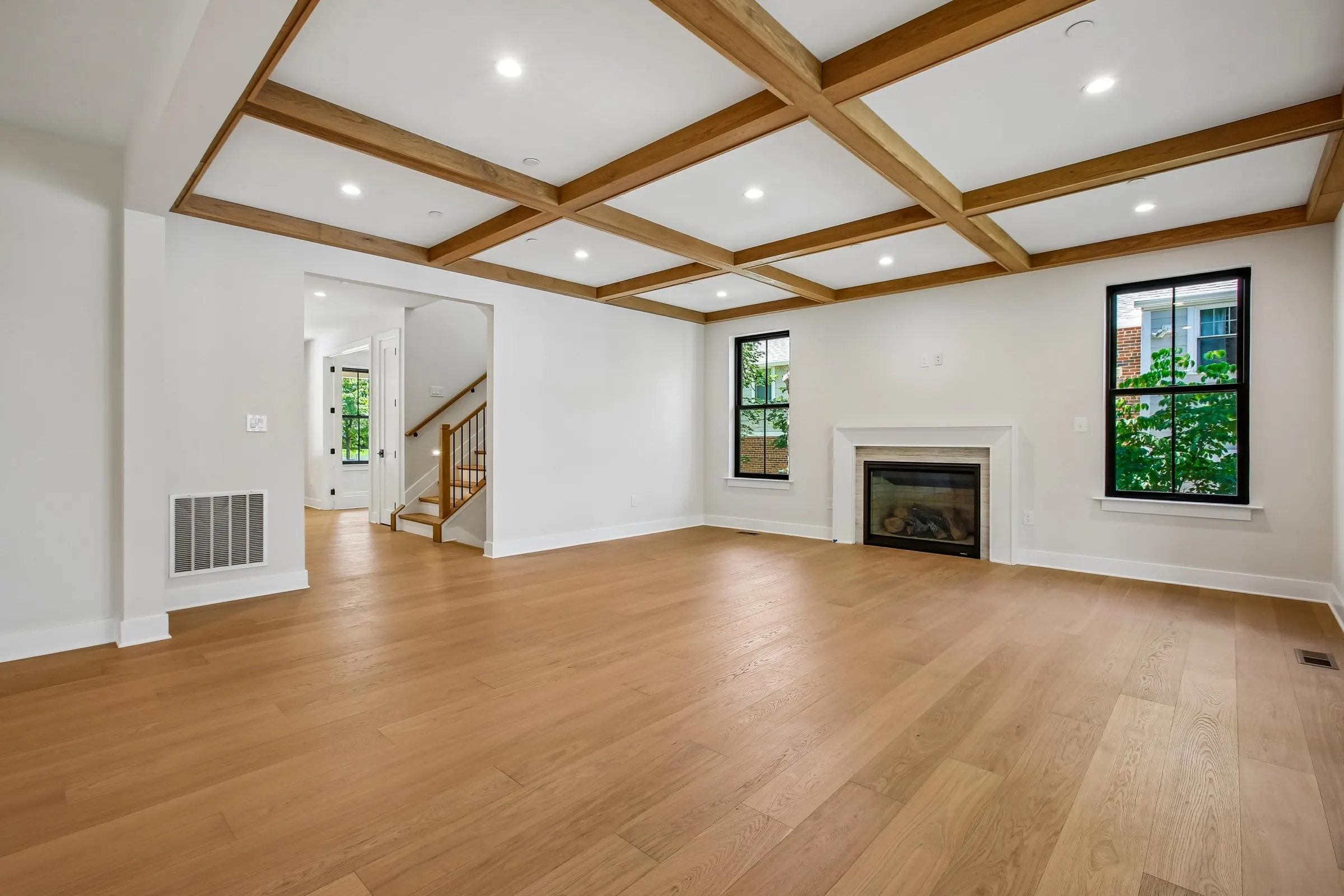 Great room opening to the kitchen and covered deck at 6003 Melvern Dr