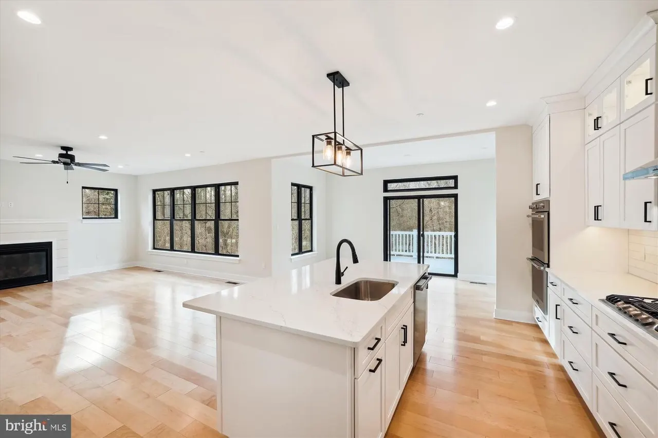 Open concept kitchen and living area with fireplace