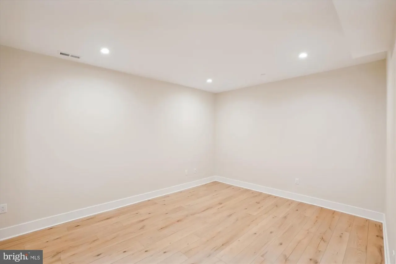 Bedroom with hardwood floors and recessed ceiling lights